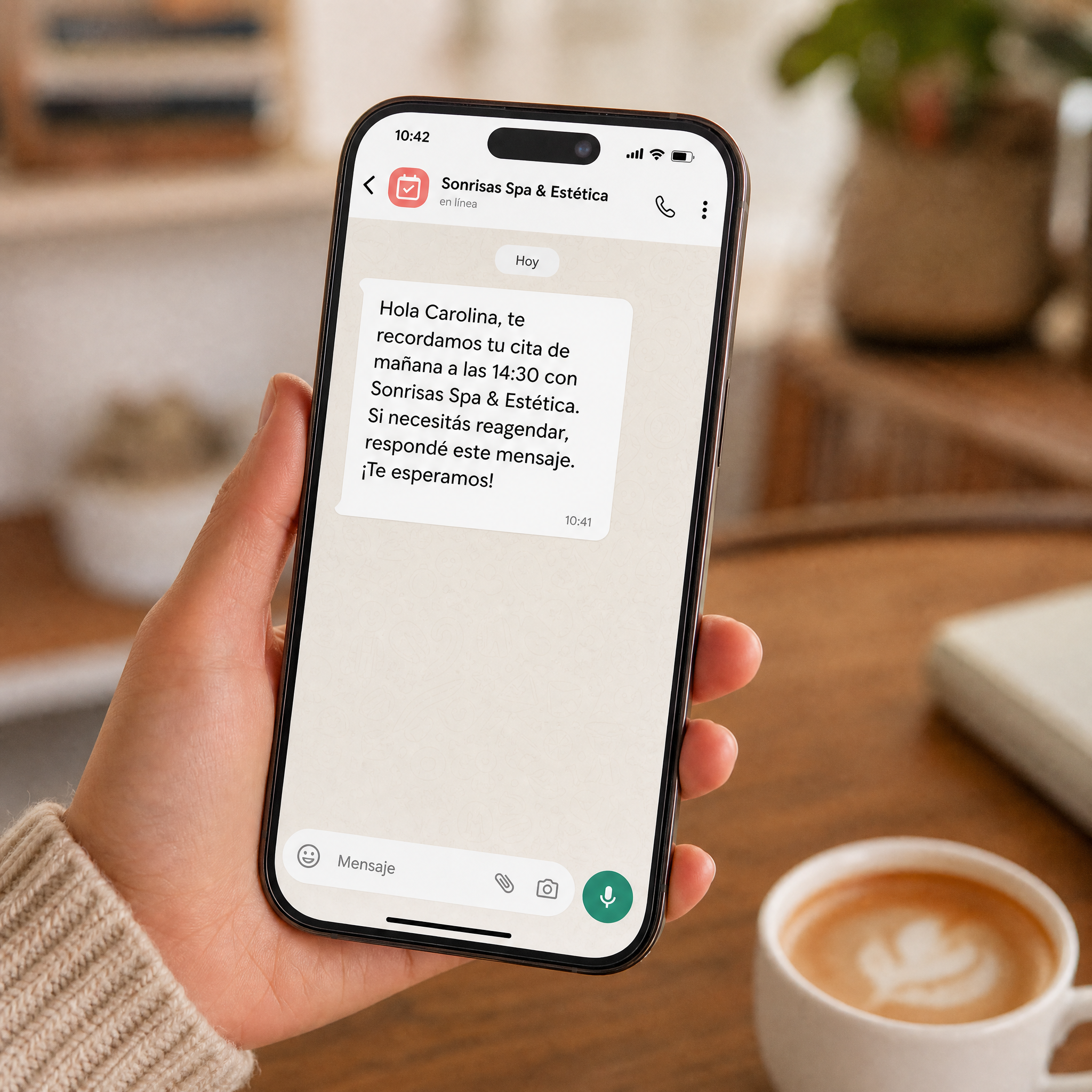 Mensaje de WhatsApp con recordatorio de cita en el celular del cliente